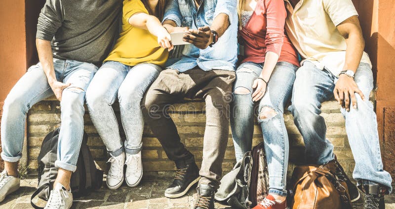 Group of multiculture friends using mobile smart phones