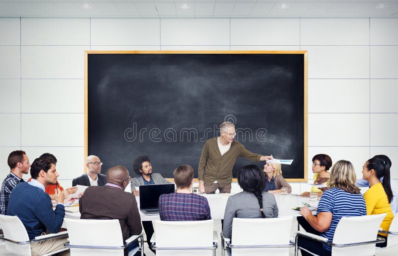 Group of Multiethnic Students Listening to the Speaker stock photo Group of Multiethnic Students Listening to the Speaker stock photo
