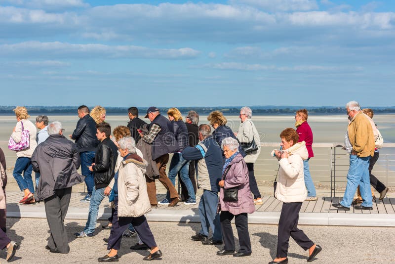 Group of old people visiting Mont Saint Michel monastery royalty free stock photos Group of old people visiting Mont Saint Michel monastery royalty free stock photos