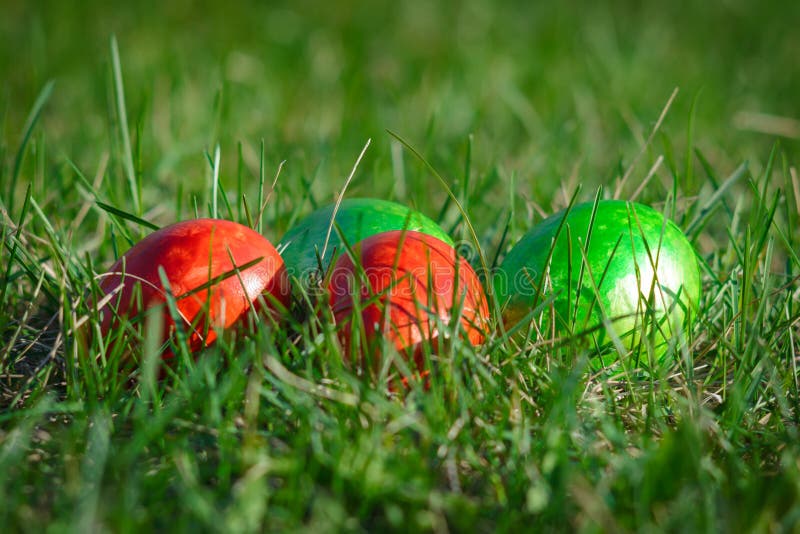 Group of Wax Painted Easter Eggs Spread on Black Plate, Flower