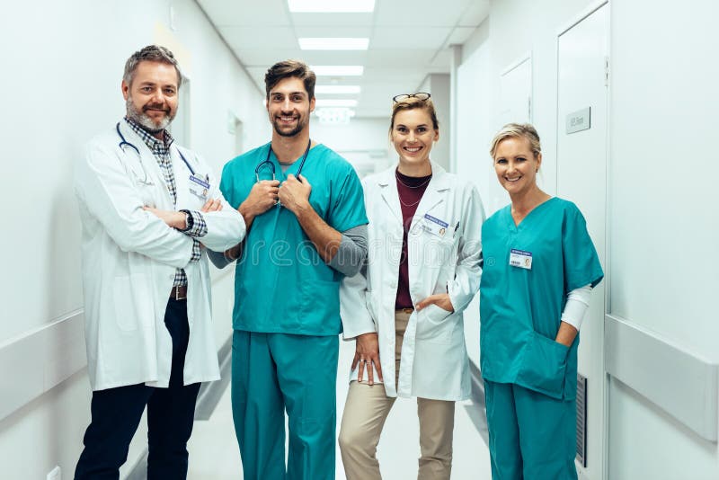 Group of paramedics standing in hospital corridor stock photos Group of paramedics standing in hospital corridor stock photos