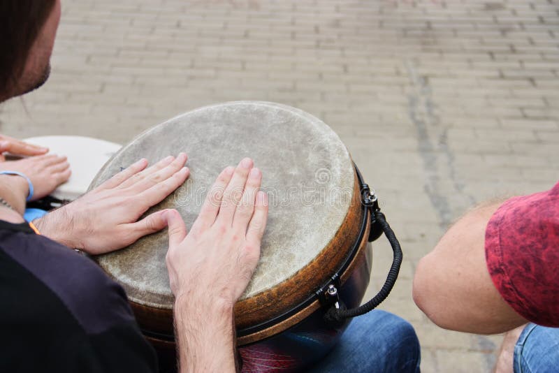 Group of people with African drums royalty free stock photography