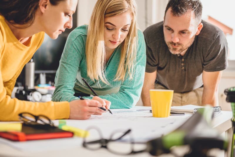 Group of People Checking Blueprints Stock Image - Image of indoors ...