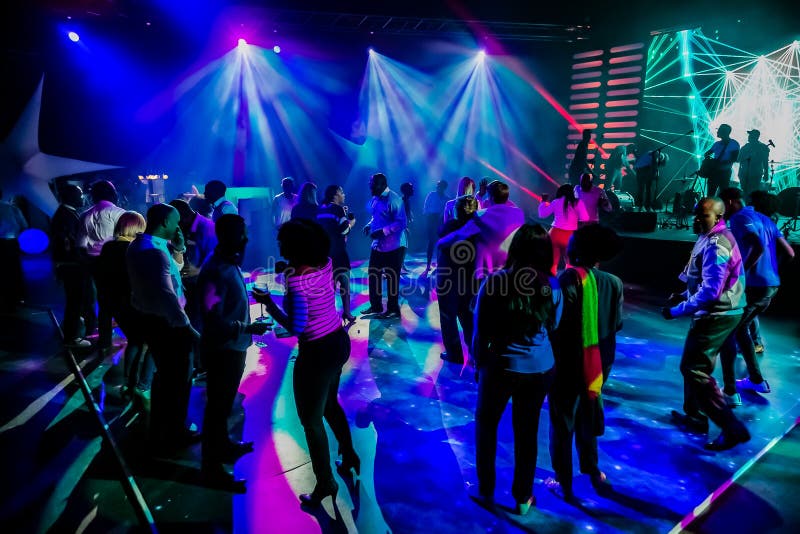 Group of People Dancing on a Dance Floor in Dark Night Club Environment ...