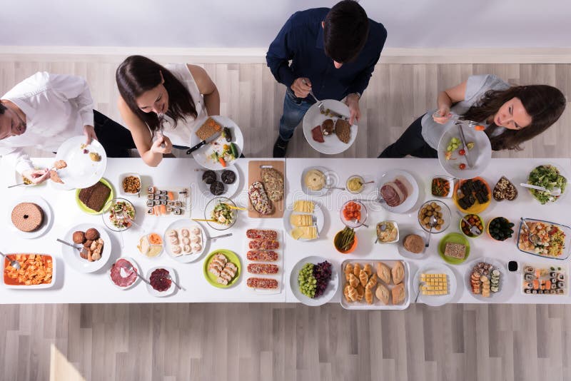 Group Of People Eating Food On Plate stock image Group Of People Eating Food On Plate stock image