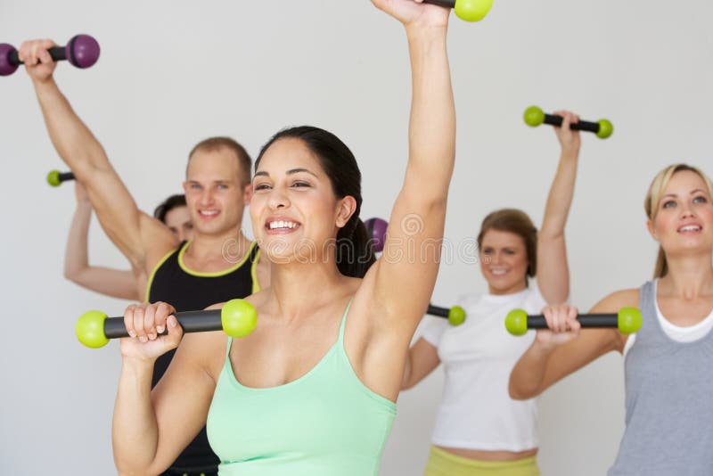 Group Of People Exercising In Dance Studio With Weights stock image