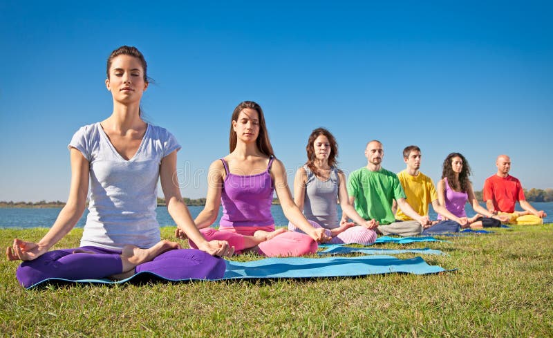 Group of people have meditation on yoga class.