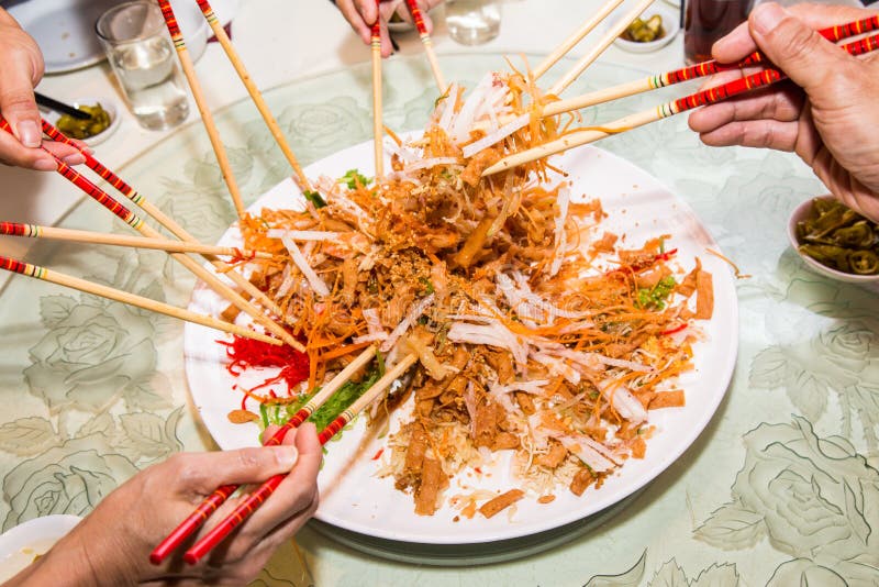 chinese new year tossing noodles