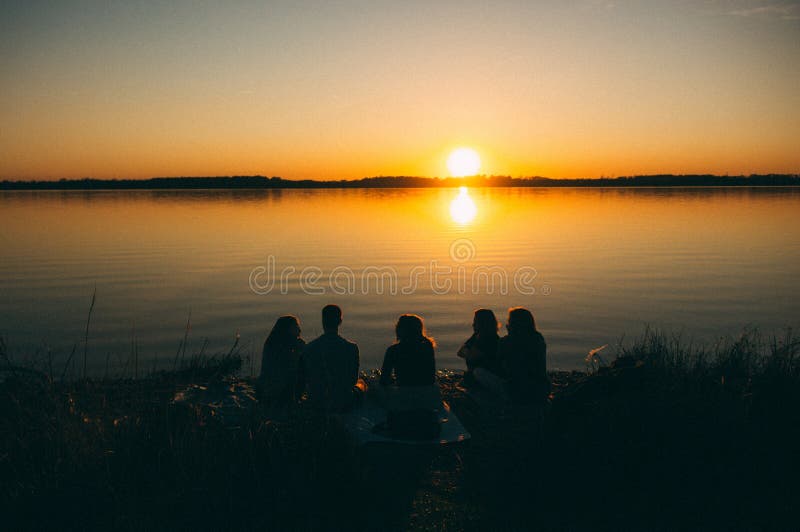 group-people-sitting-sea-enjoying-beautiful-view-sunset-172994569.jpg