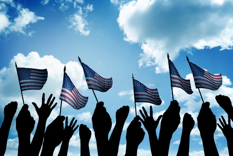 Group of people waving small USA flag