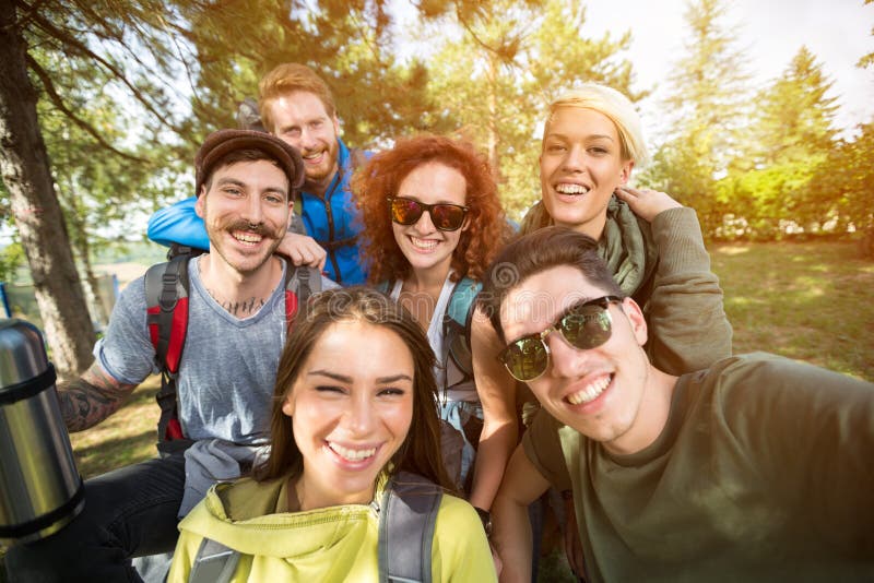 Group photo of smiling hikers in wood royalty free stock photography Group photo of smiling hikers in wood royalty free stock photography
