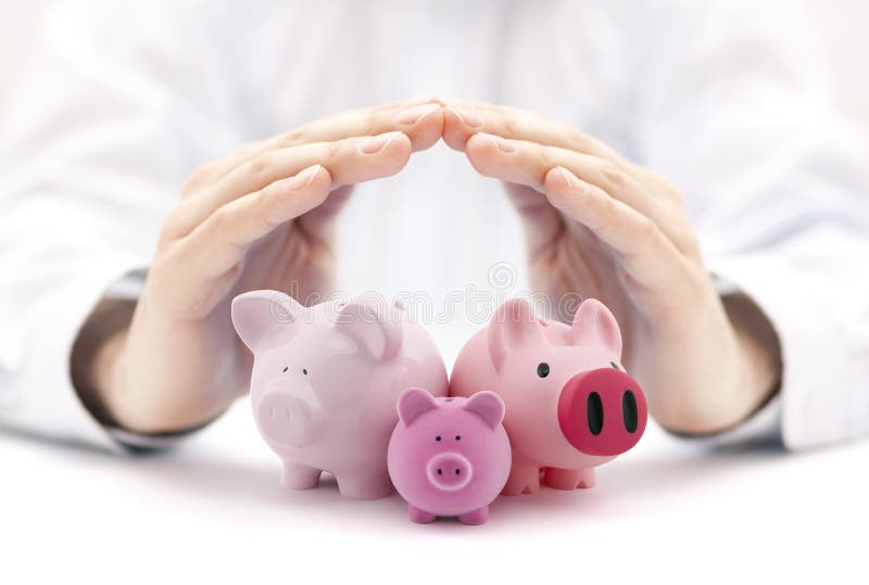Group of piggy banks covered by hands