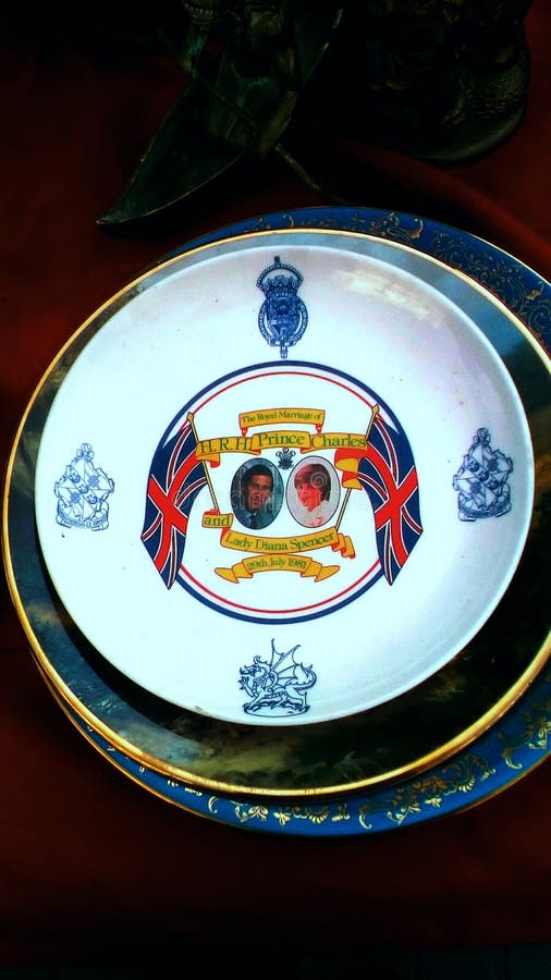 Group of plate on table for sale as souvenirs in street market.The plate in the top has two portrait design on.One of them is Lady Diana portrait design and the other is Prince Charles portrait design.The plate is from 1981.