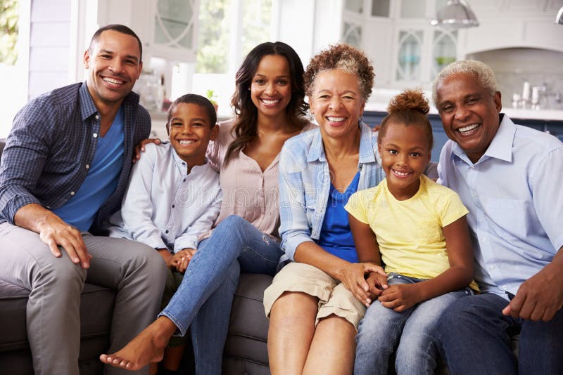 Group portrait of multi generation black family at home