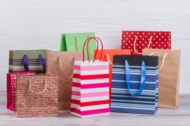 Group of printed paper shopping bags.