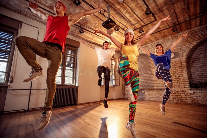 Group of professional dancer training modern dances in studio