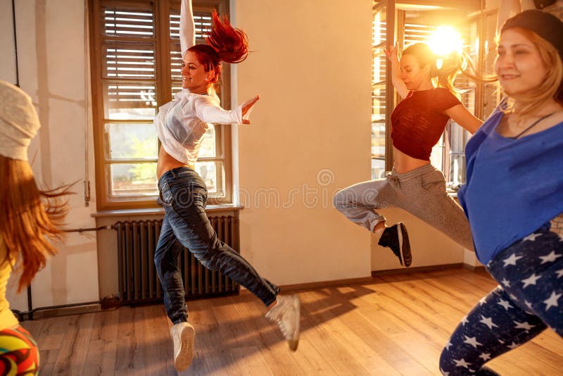 Group of professional people training modern dances in studio