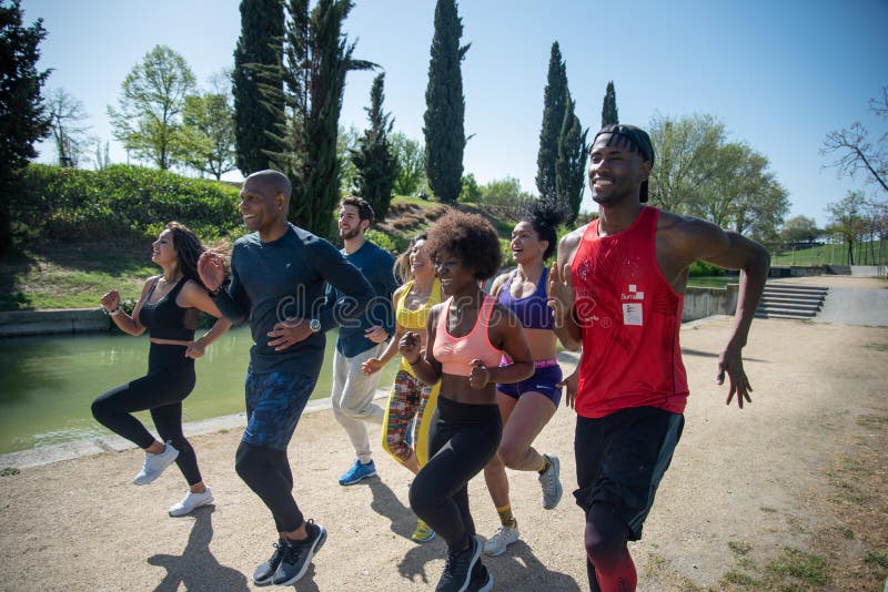 Group of Runners Training in a Park. Stock Image Image of young