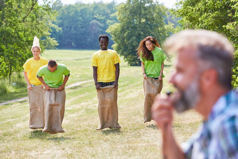 Group in Sack Race Competition Stock Photo - Image of building ...