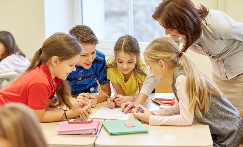 Group of school kids writing test in classroom stock photography Group of school kids writing test in classroom stock photography