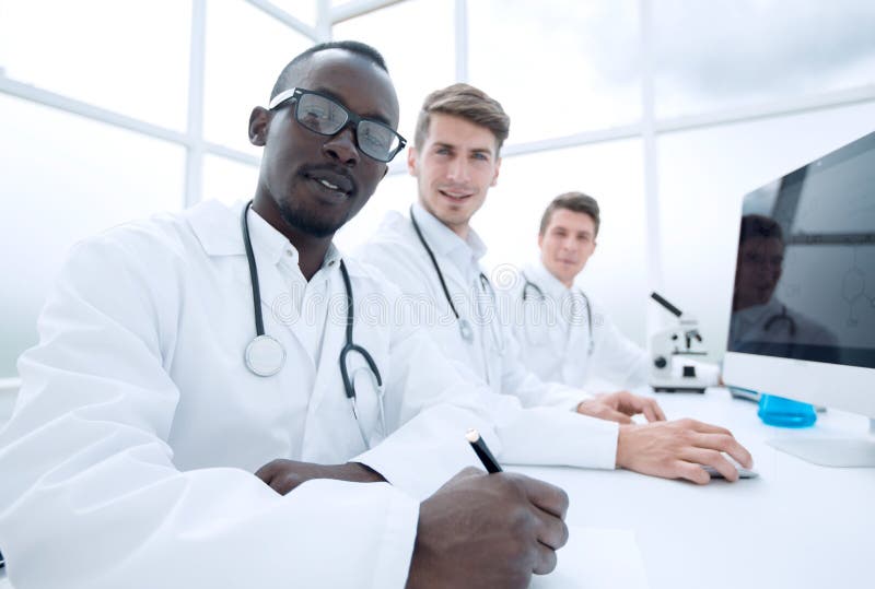 Group of scientist working in modern lab stock photos Group of scientist working in modern lab stock photos