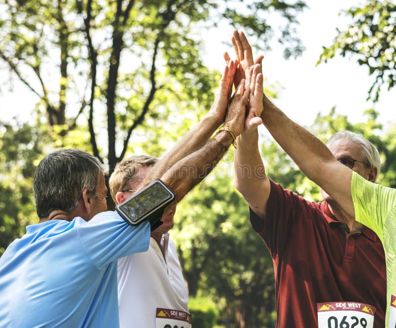 Group of Senior Athletes Giving a High Five Stock Photo Image of