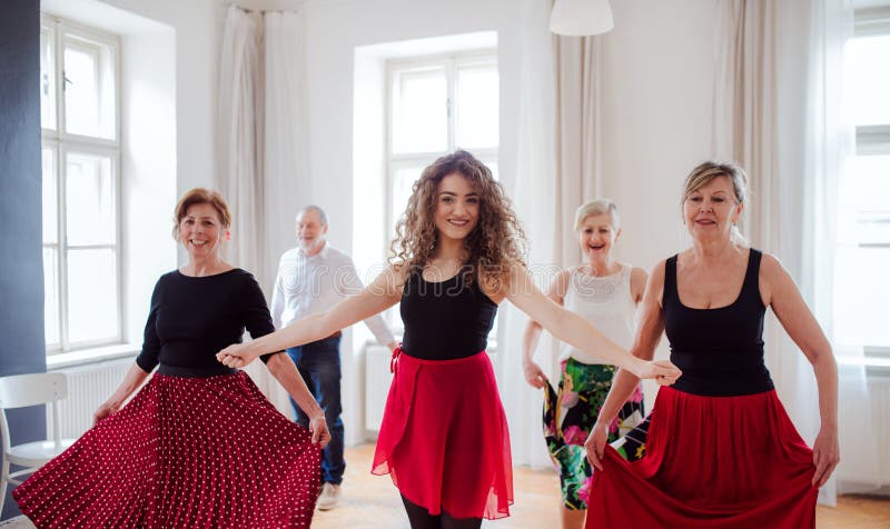 Group of senior people in dancing class with dance teacher. stock photo Group of senior people in dancing class with dance teacher. stock photo
