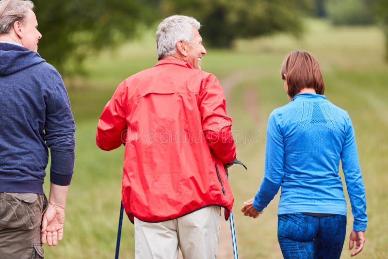 Group of seniors doing Nordic walking royalty free stock photos Group of seniors doing Nordic walking royalty free stock photos