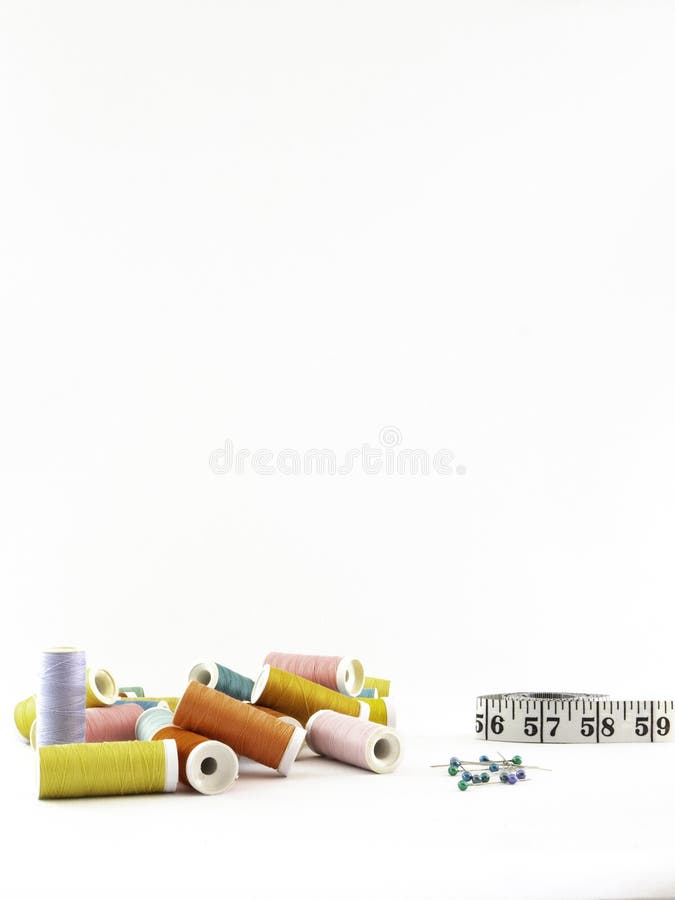 Group of sewing threads in many colors on a white background. stock photos Group of sewing threads in many colors on a white background. stock photos