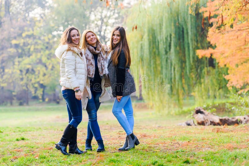 Group of Smiling College Girls Walking in the Park - Friendship Stock ...