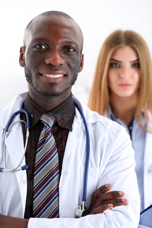 Group of smiling friendly medicine doctors look in camera