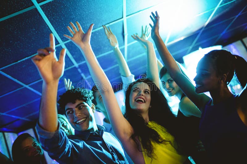 Group of Smiling Friends Dancing on Dance Floor Stock Photo - Image of ...