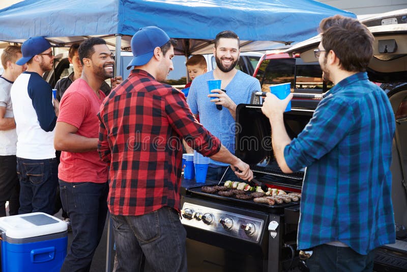 Group Of Sports Fans Tailgating In Stadium Car Park royalty free stock photography Group Of Sports Fans Tailgating In Stadium Car Park royalty free stock photography