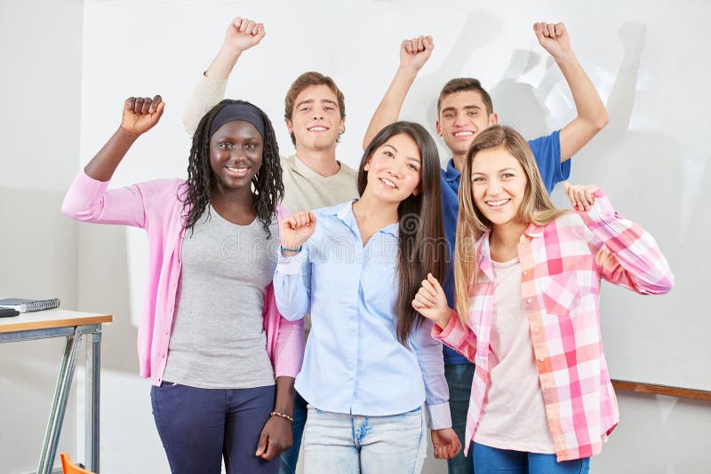 Group of students clench their fists