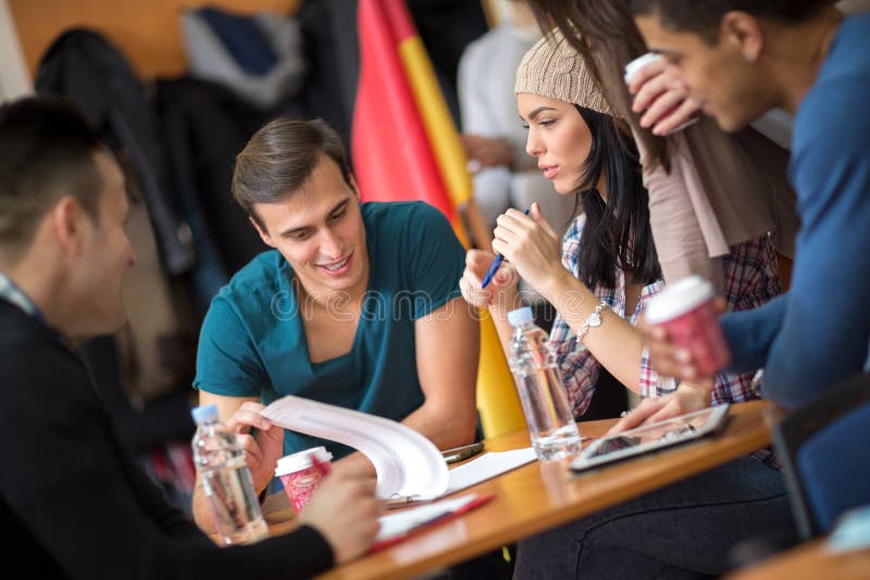 Group of students learning and discussing together