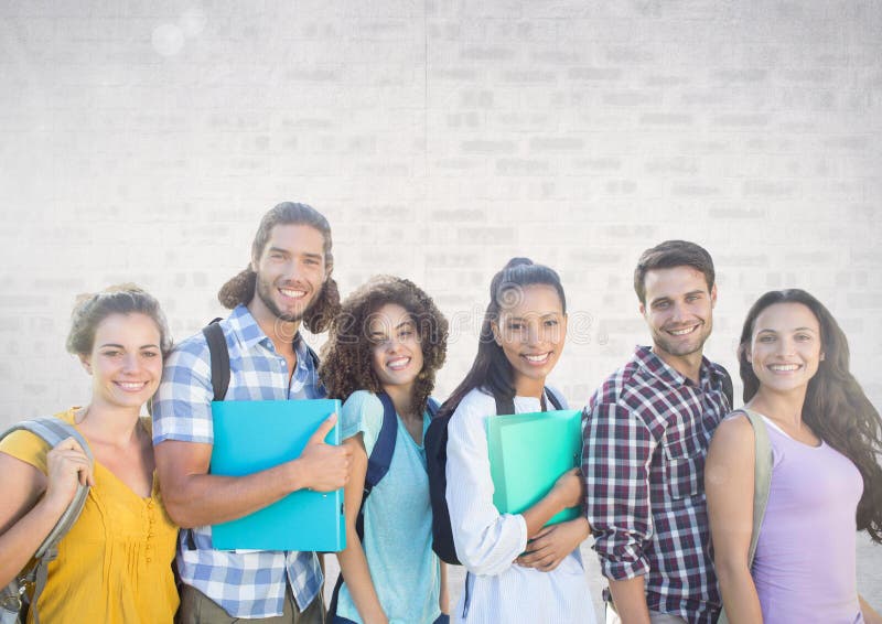 Digital composite of Group of students standing in front of brick grey background