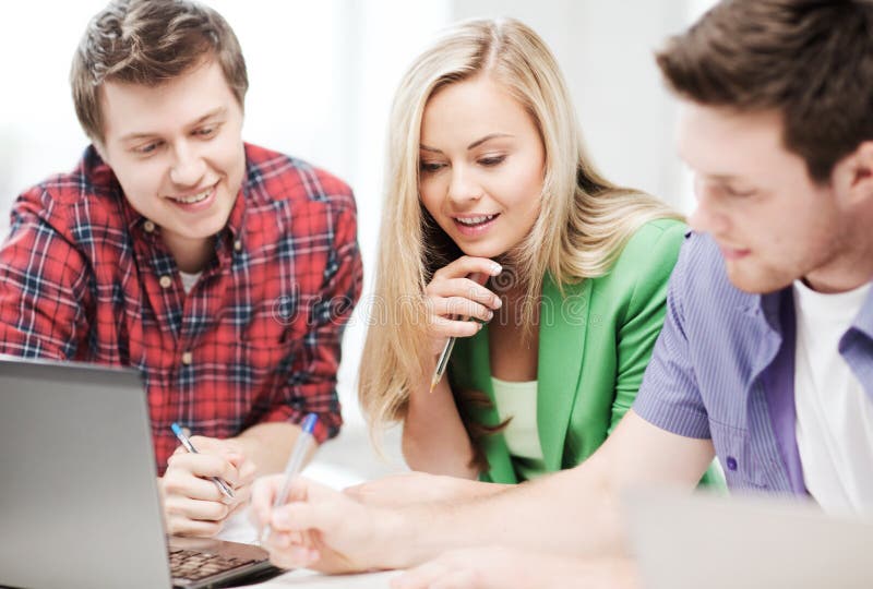 Group of students studying at school