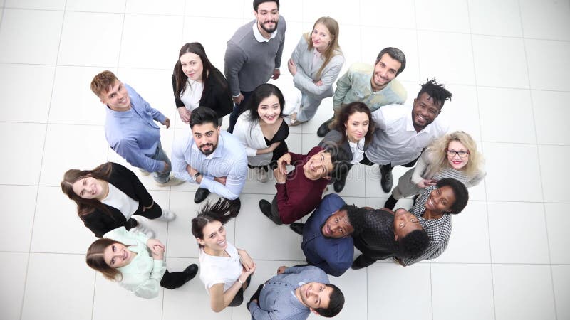 A Group of Successful Business Diverse People in the Office Stands ...