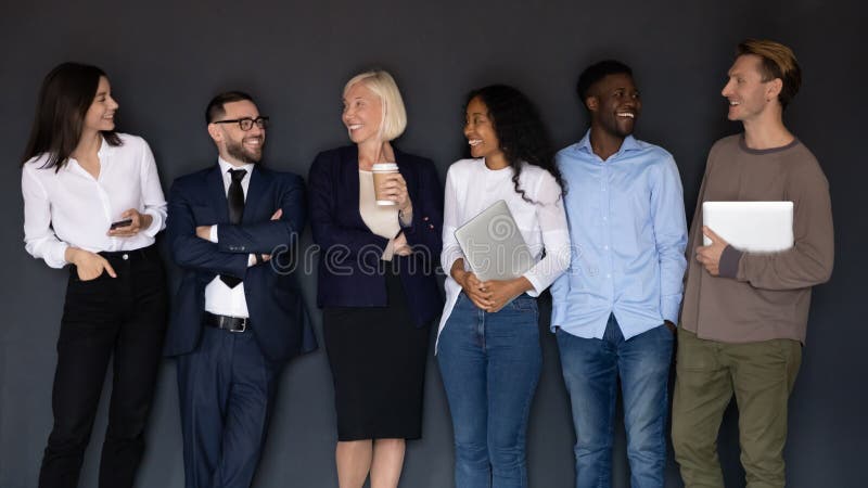 Group of successful happy diverse young and older business people.