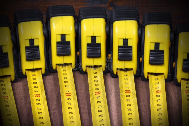 Group of Tape Measures on Wooden Table Stock Photo Image of accuracy