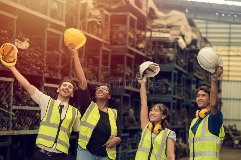 Group of Teamwork Worker mix race enjoy team working in heavy industry factory standing help together greeting success smiling stock photos