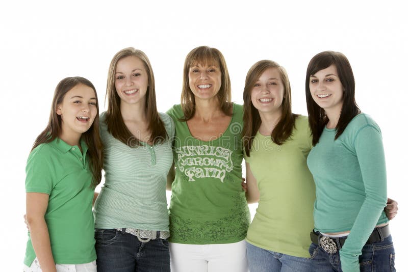 Group Of Teenage Girls With Mother looking at camera