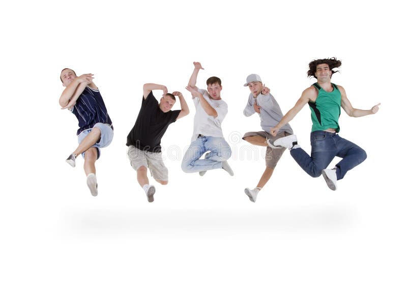 Group of teenagers jumping over white