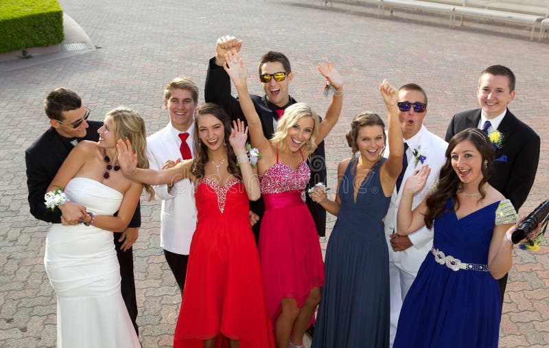 A Group of Teenagers at the Prom posing for a photo