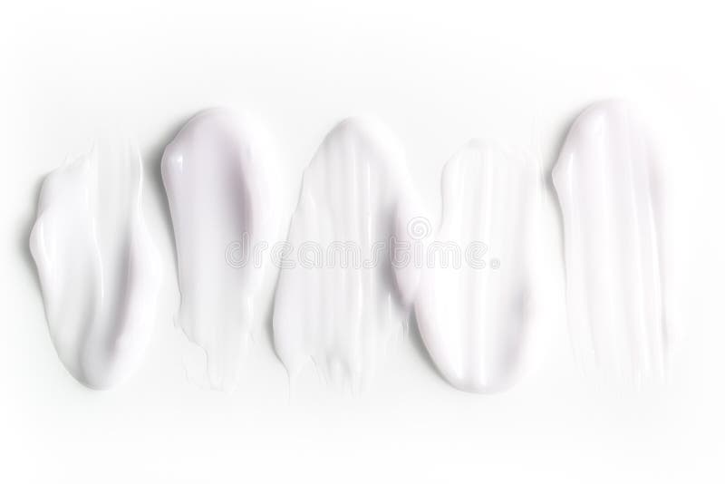 A Group of Textured Strokes of Moisturizers on a White Background