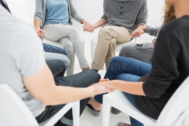 Group therapy in session sitting in a circle royalty free stock photo