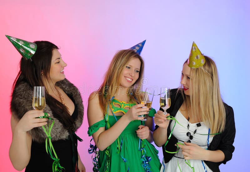 Group of three beautiful elegant woman celebrating