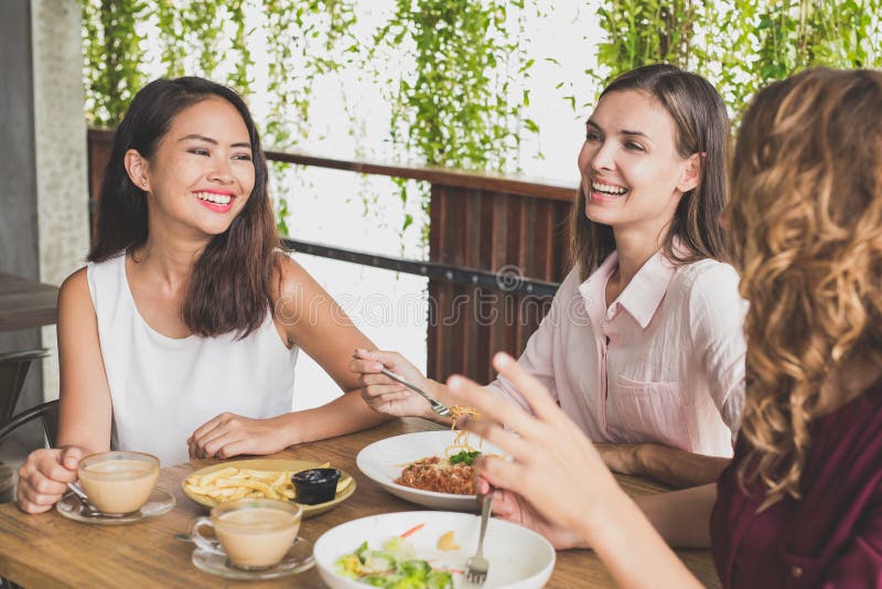 Group of three best friend having fun conversation while lunch t royalty free stock photos Group of three best friend having fun conversation while lunch t royalty free stock photos