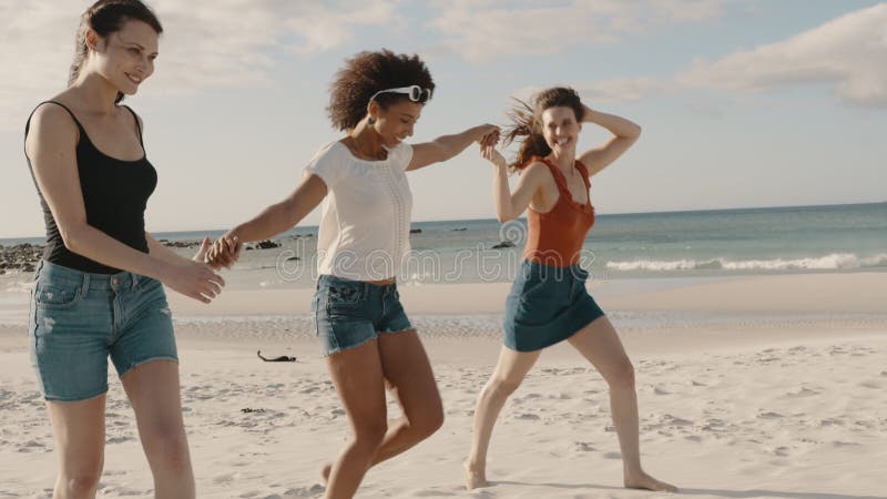 Group of three friends enjoying on the beach