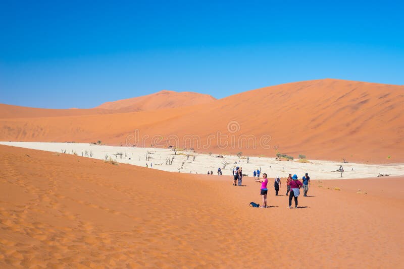Group of tourist at Sossusvlei, Namib Naukluft National Park, travel destination in Namibia. stock photography Group of tourist at Sossusvlei, Namib Naukluft National Park, travel destination in Namibia. stock photography